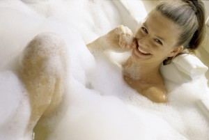 Portrait of a young woman in a bubble bath